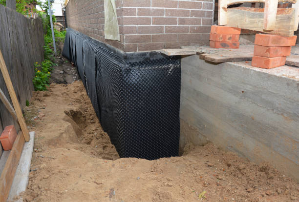 Happy homeowners after waterproofing job in Tucker